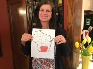 Foster Care Case Manager Holding Map of southern Wisconsin
