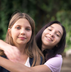 two girls hugging